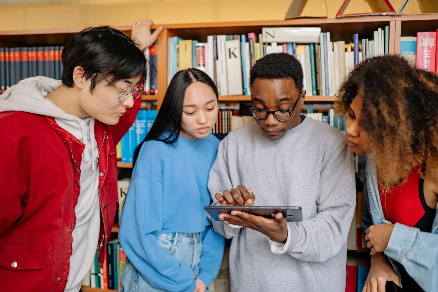 International students studying together in a modern university library